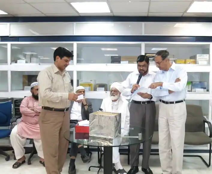 BrainTEL Hajj sponsorship ceremony showing management presenting sponsorship to selected employee